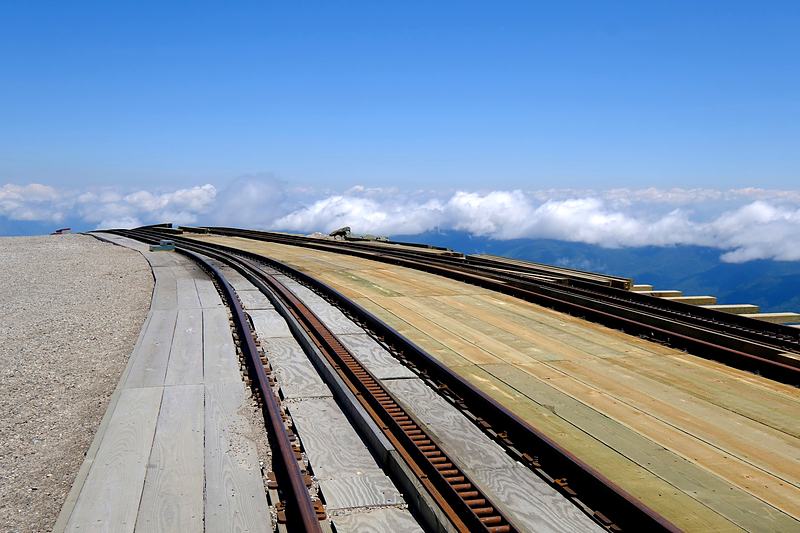 Railway track curving away as a single leading line