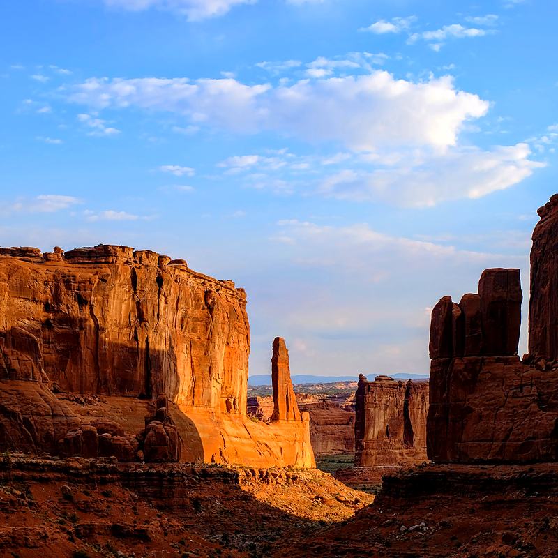 Sandstone towers under a hard blue sky