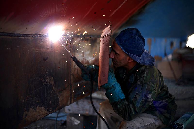 Reference frame: welder at work inside a steel structure