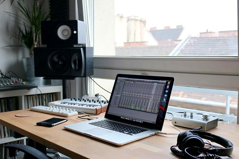 Reference frame: a home studio desk with monitors and a laptop