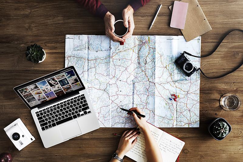 Reference frame: a group working around a table spread with a map