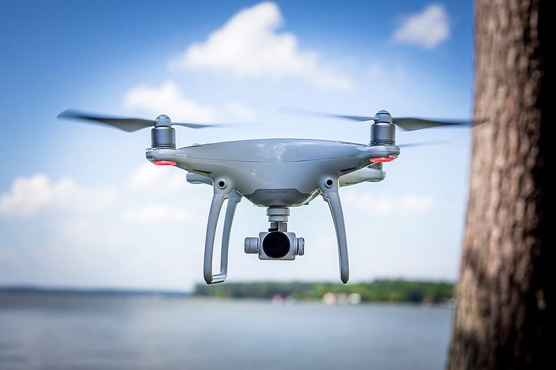 Reference frame: quadcopter hovering above a lake shore