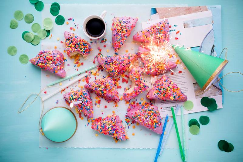 Reference frame: a party flat lay with confetti and cake