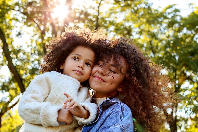 Reference frame: a mother and daughter outdoors at golden hour