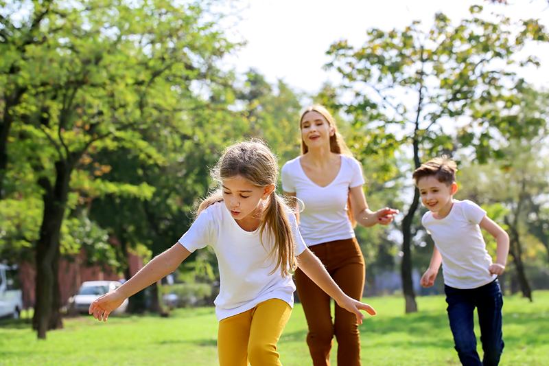 Reference frame: a family playing together in the park