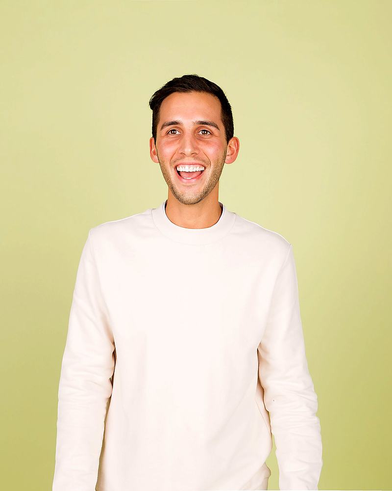 Reference frame: studio headshot against a pale background