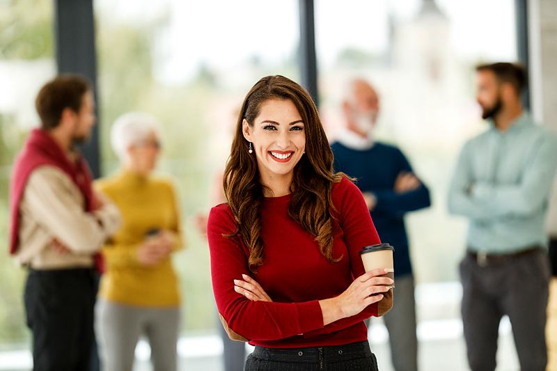 Reference frame: a professional portrait with a natural smile, workplace setting