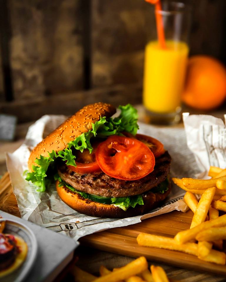 Reference frame: a burger and fries styled with drinks