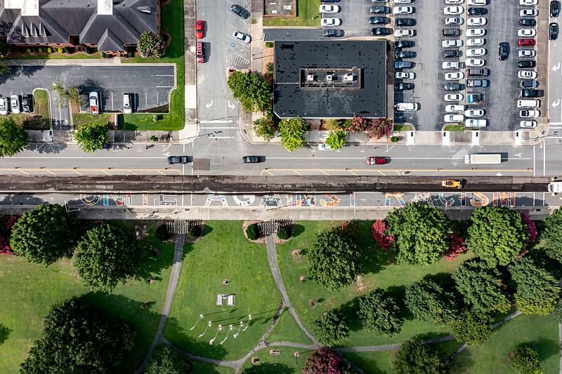 Reference frame: an aerial of a street and the green space beside it