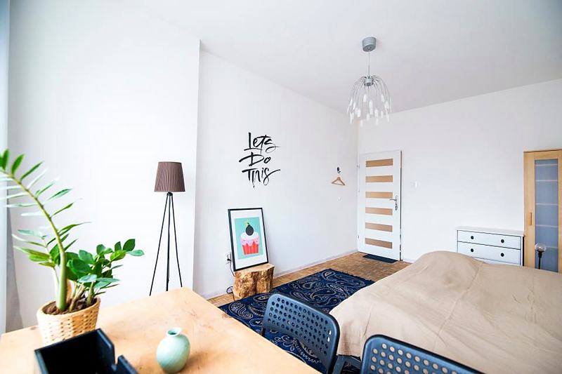 Reference frame: a bedroom with a study corner under a warm lamp