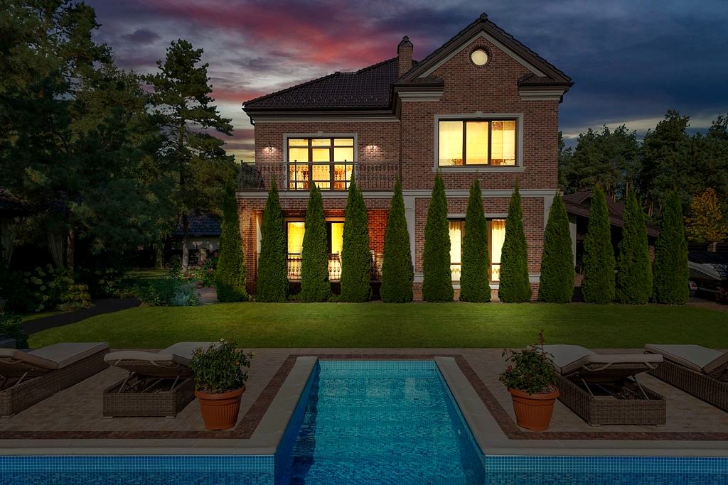 Reference frame: a house at dusk with its windows lit and a pool in the foreground