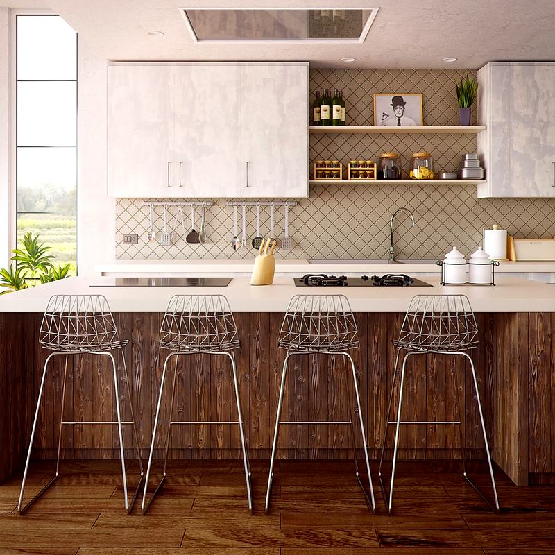 Reference frame: a kitchen island with bar stools and pale cabinetry