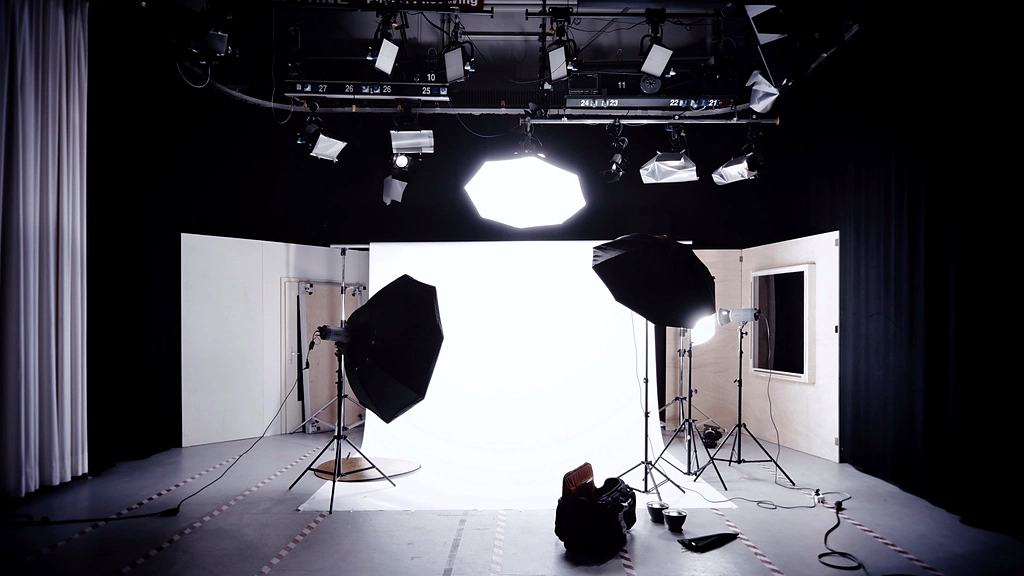 Reference frame: an empty studio with lights and stands set for a shoot