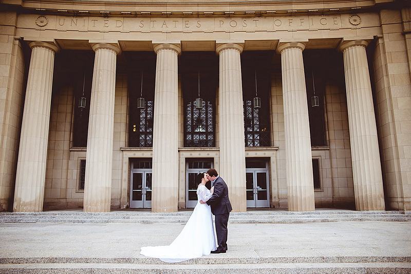 Reference frame: bride and groom before a colonnaded building