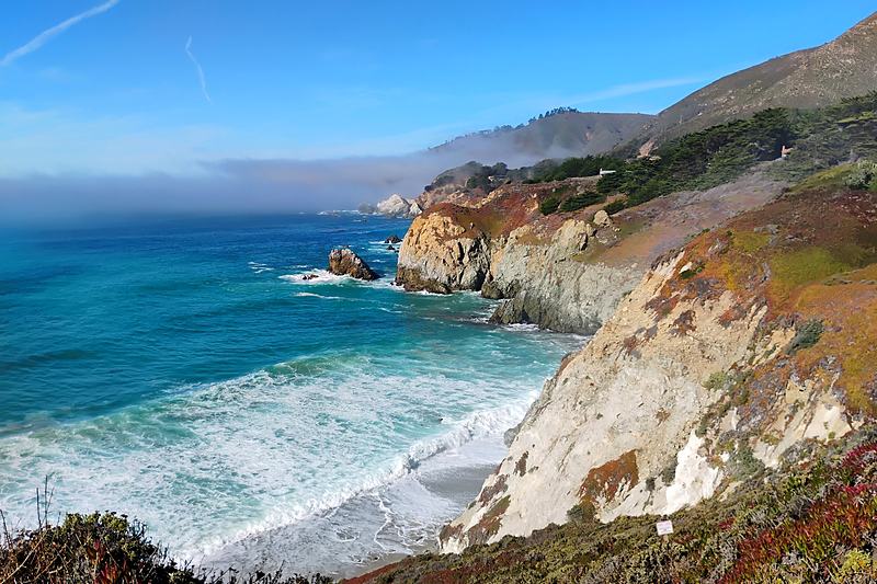 Turquoise cove enclosed by pale cliffs